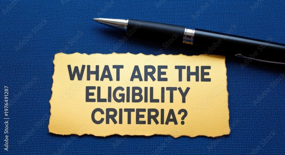 custom made wallpaper toronto digitalQuestion about eligibility criteria with a pen on a textured blue background, concept of requirements and qualifications