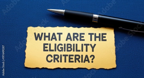 Wallpaper Mural Question about eligibility criteria with a pen on a textured blue background, concept of requirements and qualifications Torontodigital.ca