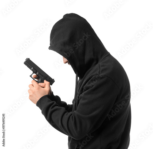 Fotografie Hooded man with gun on white background