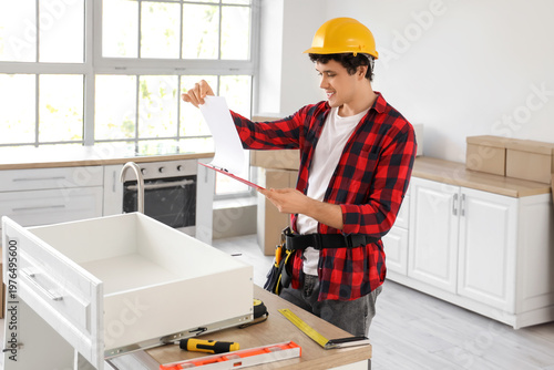 Male worker with clipboard ...