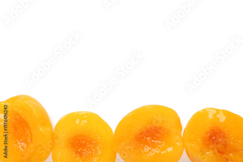 Sweet canned peaches on whi...