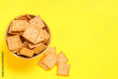 Bowl with tasty crackers on...