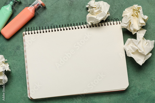 Notebook and crumpled piece...