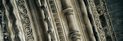 Details of antient medieval architecture with carved stone reliefs.