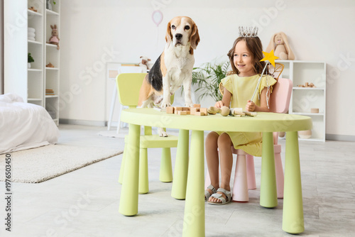 Cute little girl with Beagl...