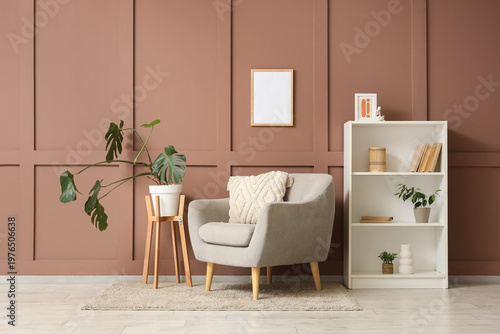Comfortable grey armchair w...
