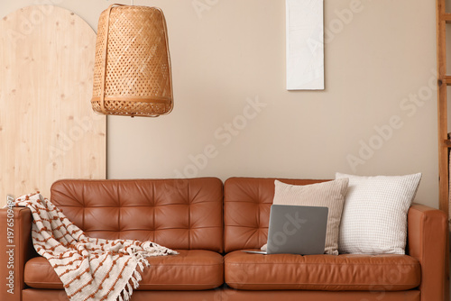 Brown leather sofa with sof...