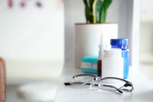 Eyeglasses with pills and d...