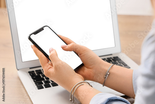Young woman holding mobile ...