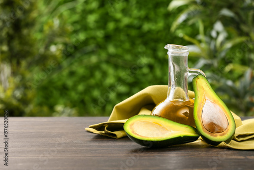 Jug of fresh avocado oil on...