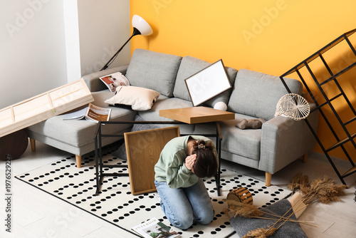 Stressed woman kneeling in ...