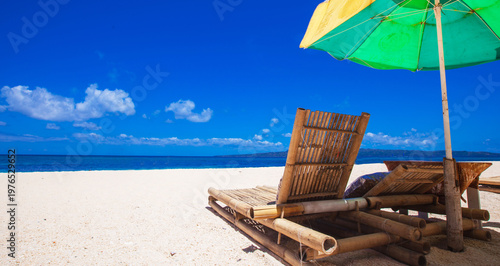sun loungers on a sandy beach