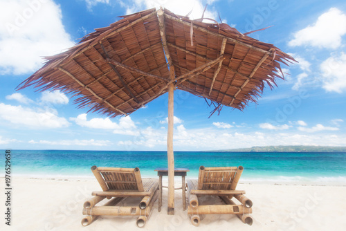sun loungers on a sandy beach