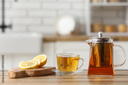 Teapot, cup of tea and wood...