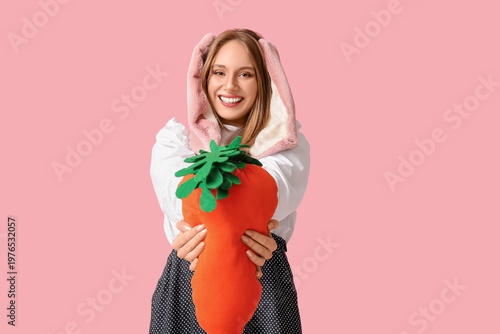 Happy woman in bunny ears w...