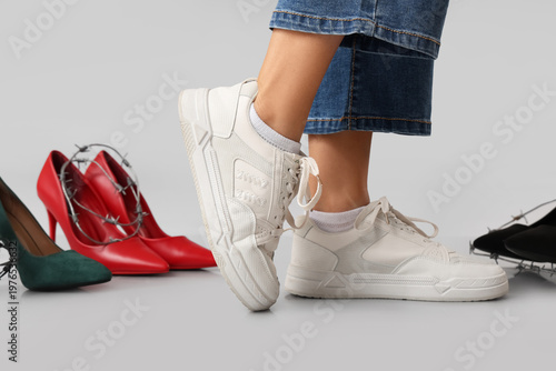 Young woman with shoes wear...