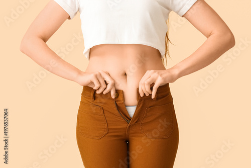 Young woman in tight pants ...