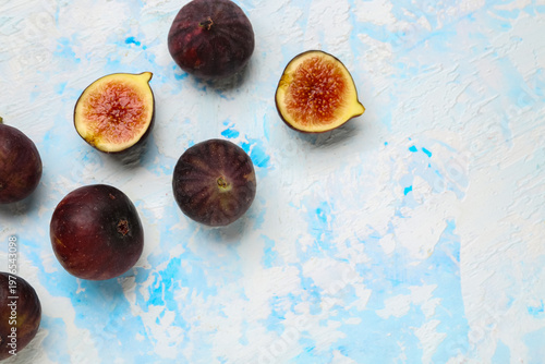 Fresh ripe figs on light bl...