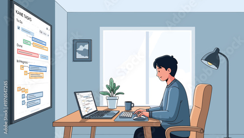 Young man working diligently on laptop at desk.