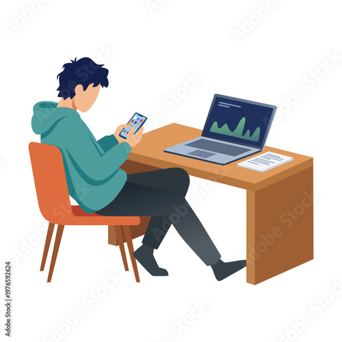Young man using smartphone at desk with laptop, digital distraction concept