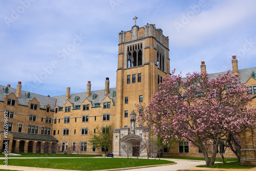 Dillon Hall at the University of Notre Dame standing under a spring sky