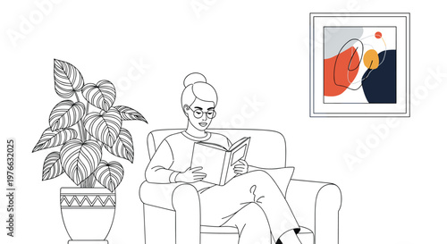 Woman wearing glasses sits comfortably in an armchair and reads a book in a stylish room with a large houseplant and abstract wall art.