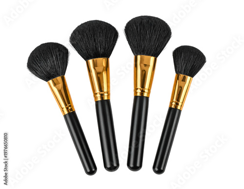 Four black makeup brushes with gold ferrules and black handles