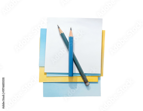 Two pencils rest on colorful papers