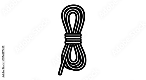Coiled black and white rope isolated against neutral background, emphasizing utility and simplicity.
