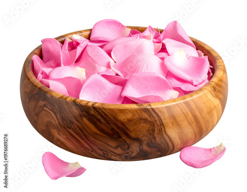 A wooden bowl overflowing with delicate pink flower petals