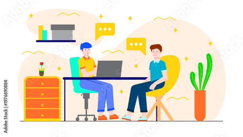 Two male colleagues discussing work during an onboarding session at a desk