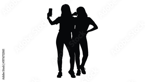 Two young women silhouetted taking a selfie with a mobile phone