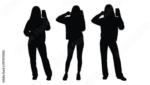 Silhouettes of three people holding up smartphones in a darkened setting