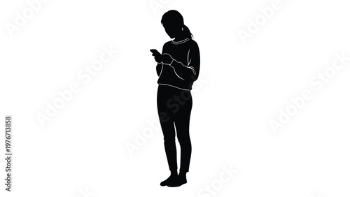 Silhouette of a woman using a smartphone standing in a casual pose