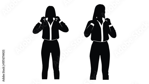 Silhouettes of two women preparing to box fists raised in a defensive stance