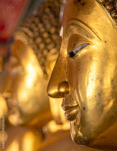 Close-up of a golden statue's face in the ancient temple