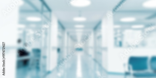 Blurred Hospital Corridor with Bright Overhead Lights and Blue Chairs