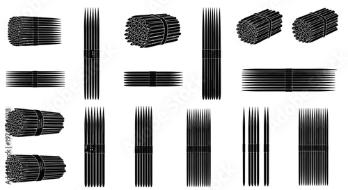 Variety of black nails and spikes in different shapes and sizes arranged on a white background for industrial or construction use