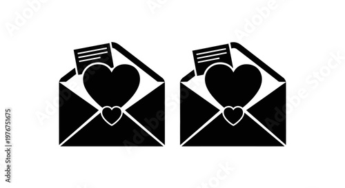 Two black envelopes each containing a heart shaped card and a smaller heart