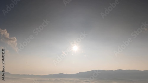 Hyperlapse video (4K) showing a stunning aerial view of the sun in the sky and light filtering through the clouds, Lampang, Thailand.