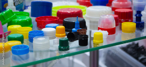 Different plastic products. Products made of multi-colored plastic. Models set of various plastic products made of plastic. Multicolored objects. Multicolored bottle caps