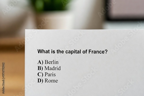 A multiple-choice question about the capital of France is displayed on a white card.