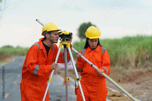 Fotografie Civil engineers are inspecting the completeness of the road construction at the wind farm