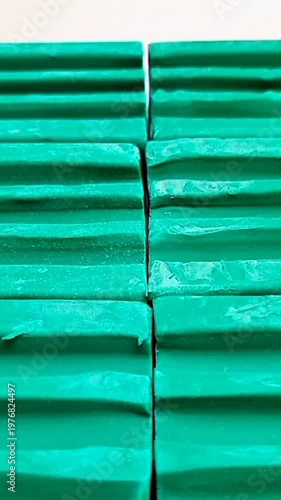 Green Dishwashing Soap Bars Moving in a Line, White Background Stock Footage, vertical clip