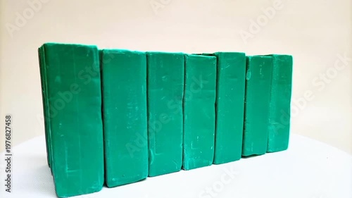 Green Dishwashing Soap Bars Rotating in a Line, White Background Stock Footage