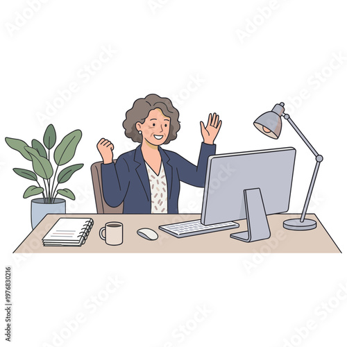 A woman sits at her desk excitedly in front of a computer.