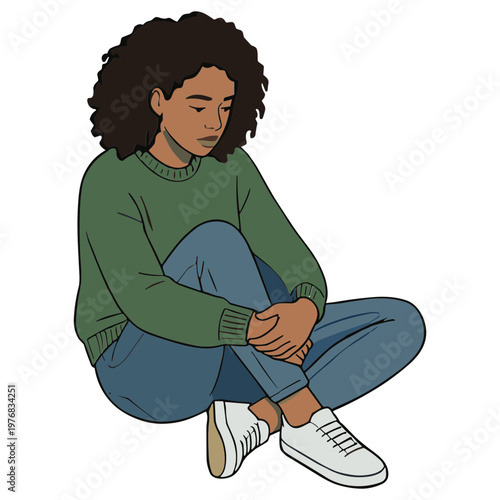 A young woman sits cross-legged on the ground looking down