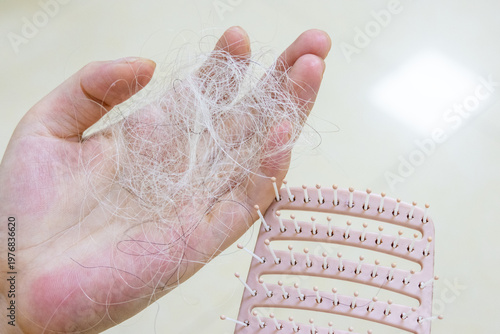 Photography Close-up of a comb and fallen white hair