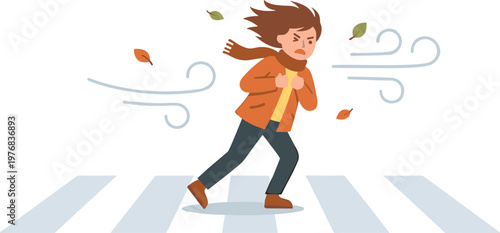 Woman runs quickly across the street on a windy day with leaves blowing.