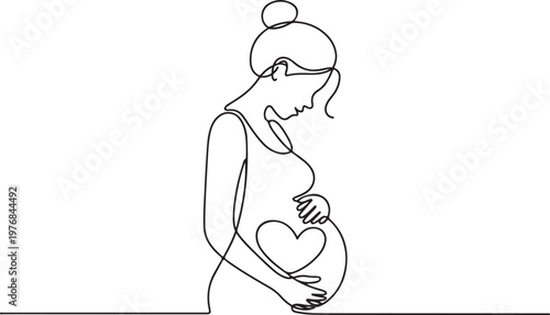 A pregnant woman gently cradling her baby bump with a heart symbol inside